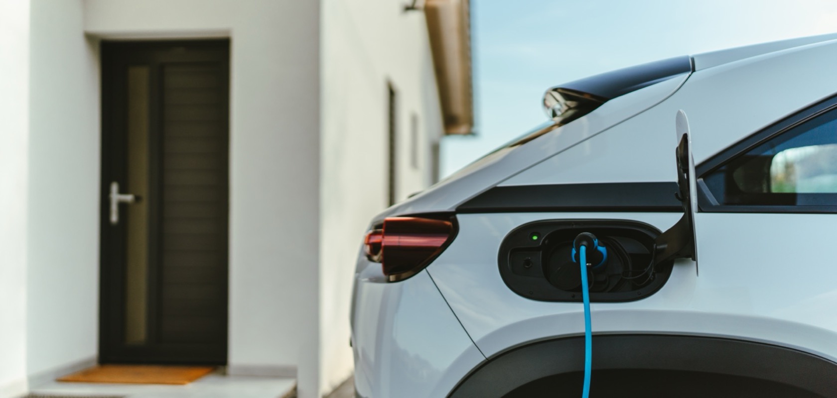 Tesla EV charger installed in a home garage for sustainable electric vehicle charging